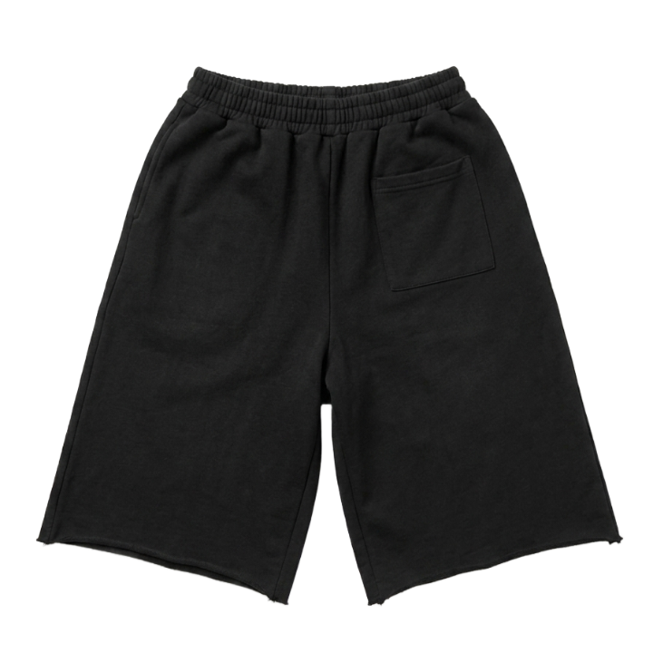 Black wide-leg sweat shorts with an elastic waistband and a side pocket, shown flat on a white background.